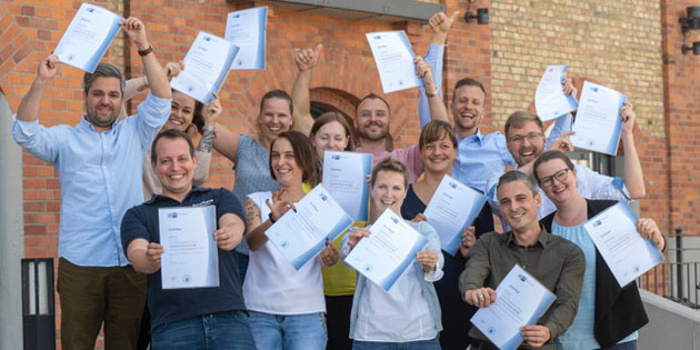 Audibene-Führungskräfte zu Systemischen Business Coaches qualifiziert